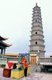 China: A man pays his respects to Guanyin in front of the Kumarajiva Pagoda, built to house the bones of the eminent Kuchean Buddhist monk, Kumārajīva (334 - 413 CE), Luoshi Si Ta, Wuwei, Gansu Province