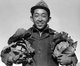 USA / Japan: Richard Kobayashi, farmer with cabbages. Manzanar Japanese American Internment Camp, Ansel Adams, 1943